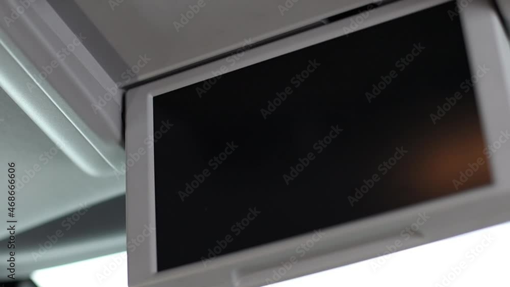 Monitor on the roof of the car. inside. Overhead monitor. Monitor on the roof of the car. inside. Overhead monitor.
