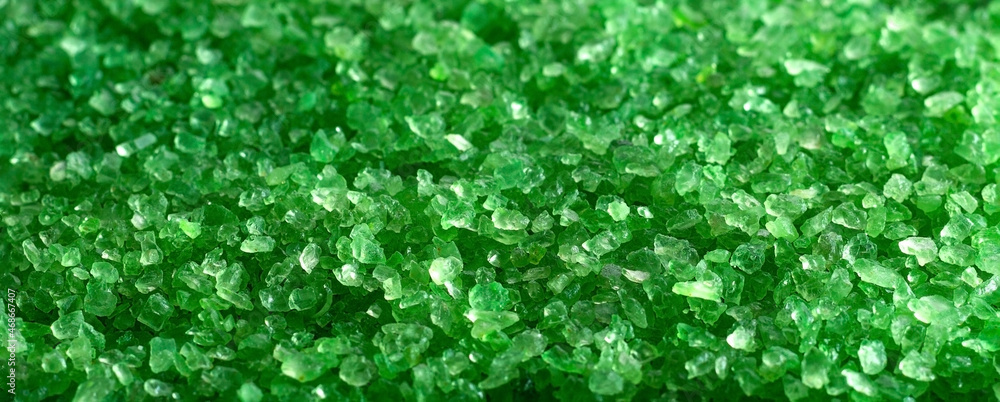 Background cosmetic sea salt for spa treatments with green fir Background cosmetic sea salt for spa treatments with green fir
