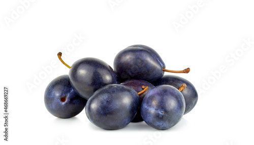 Fresh blue plums isolated on white background photo