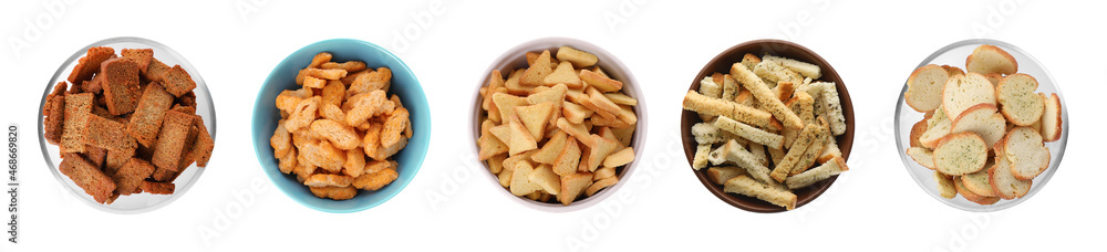 Set with different delicious crispy rusks on white background, top view. Banner design Set with different delicious crispy rusks on white background, top view. Banner design