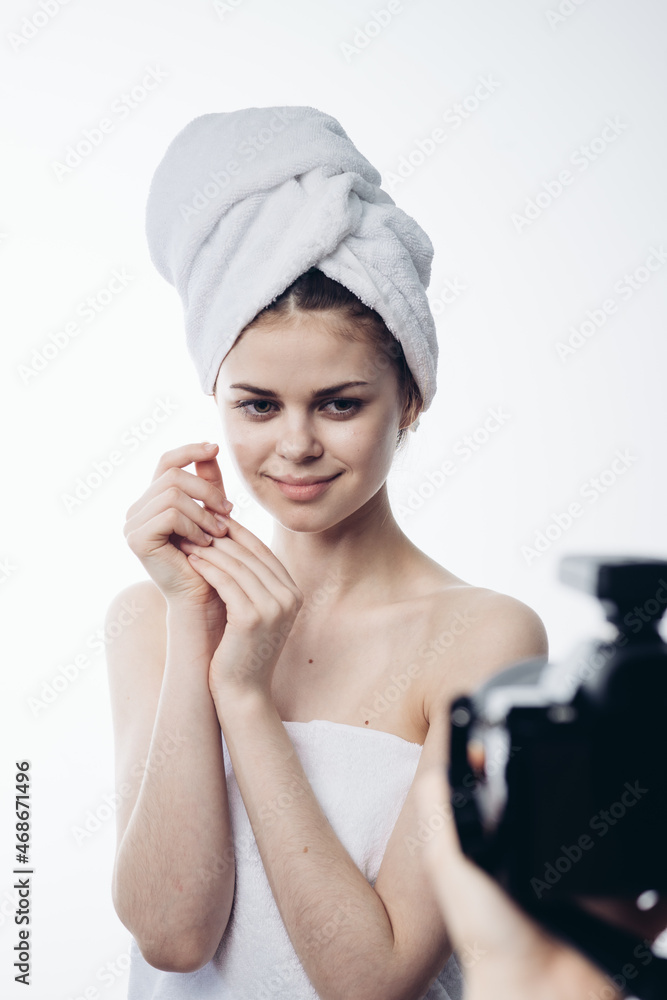 woman after shower with towel on head posing skin care woman after shower with towel on head posing skin care