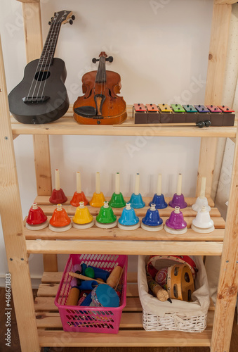 Shelf with musical instruments in montessori classroom