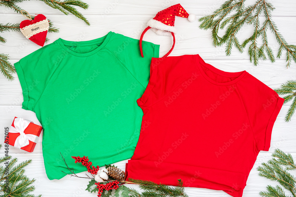 Red and green t shirt mockup with copy space and Christmas Holiday template  flatlay. Top view blank t-shirt on white background. Happy New Year  decorations Stock Photo | Adobe Stock