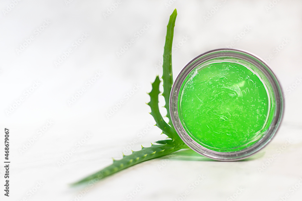 moisturizing gel cream with aloe and aloe leaves on a light background. Natural organic cosmetics for skin care. moisturizing gel cream with aloe and aloe leaves on a light background. Natural organic cosmetics for skin care.