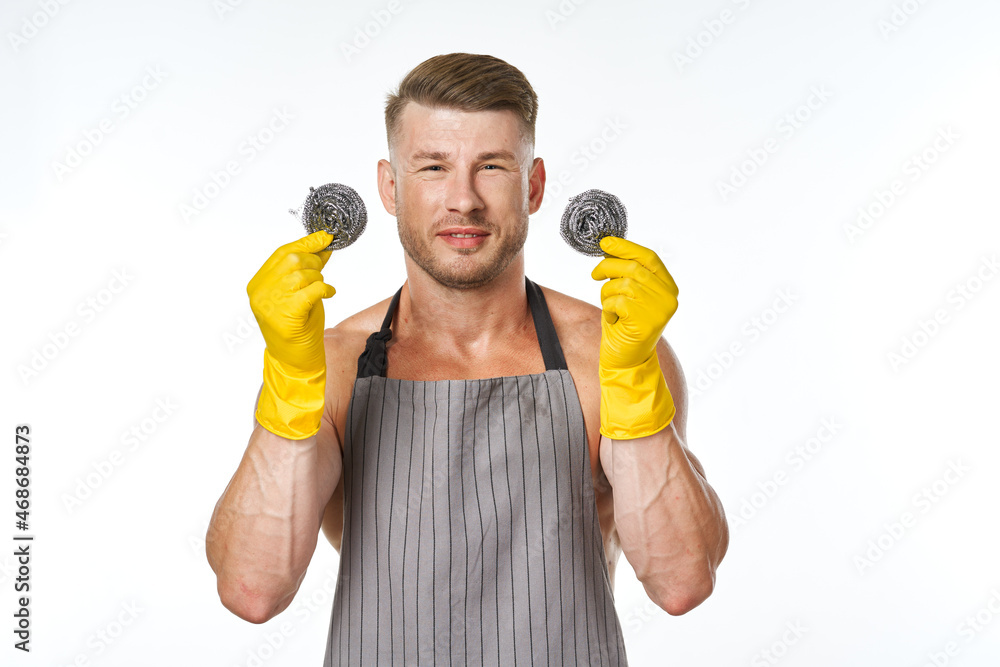 pumped up man in rubber gloves metal sponges close-up pumped up man in rubber gloves metal sponges close-up