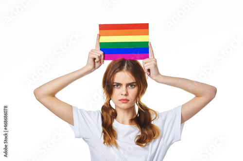 woman with lgbt flag transgender community light background