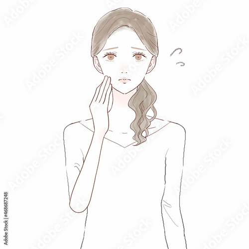 困っている女性　スキンケアのイメージ
