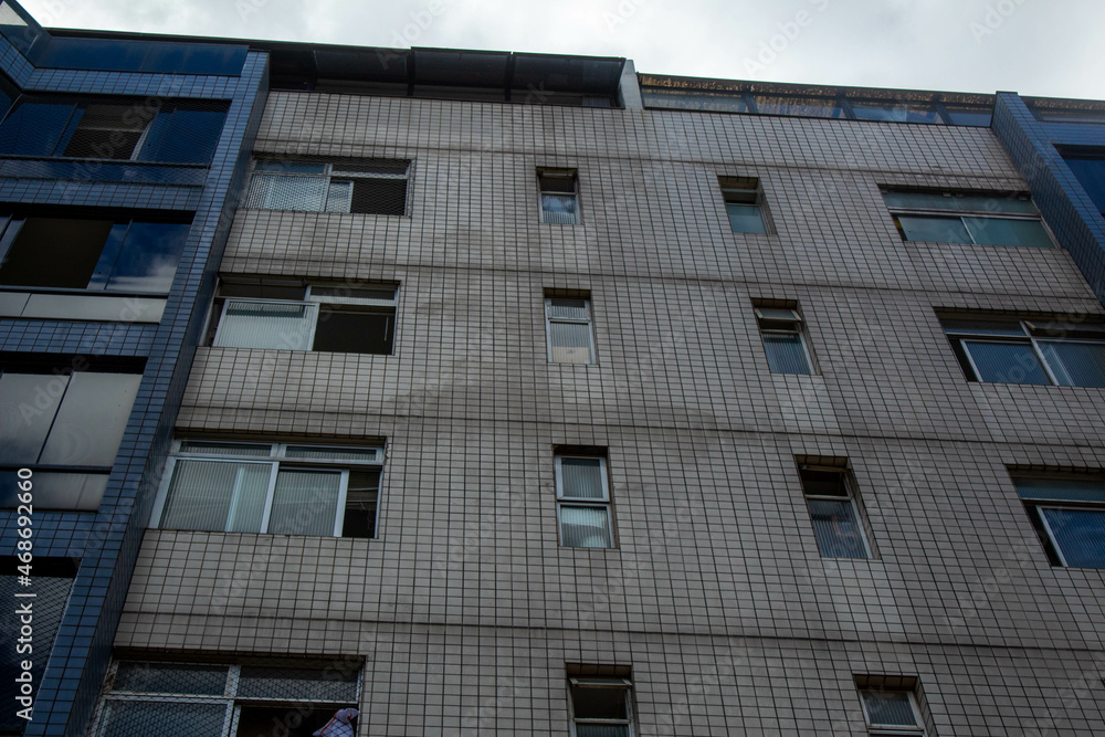 gray and blue building seen from below