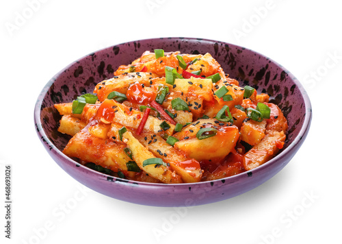 Plate with honey chilli potato on white background