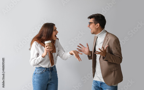 Young couple arguing on lig...