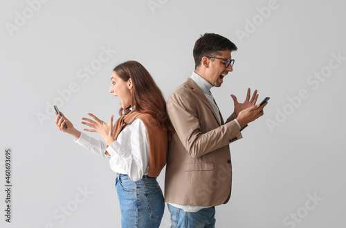 Angry young couple with mob...