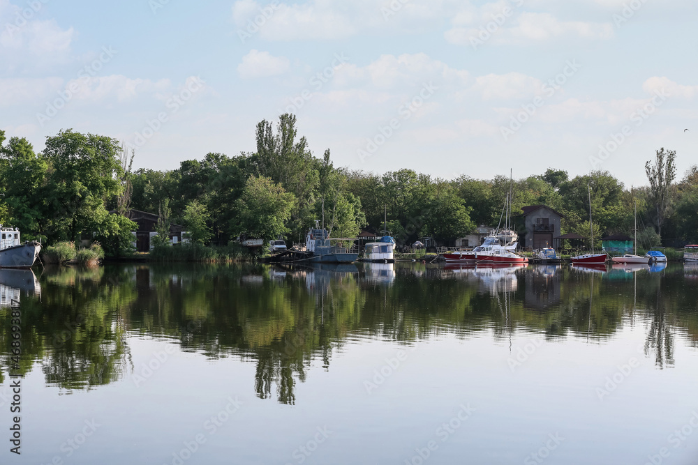 View of marina with boats in city on spring day