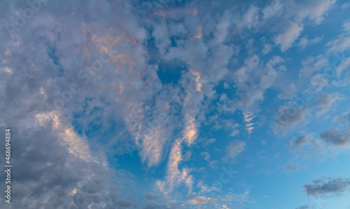 Photography Puffy altocumulus clouds in a blue sunrise sky