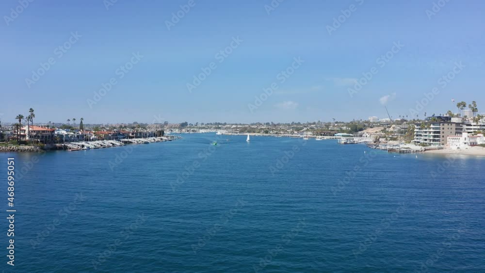 drone flight over bay channel to Newport harbor and Balboa island, in Orange county, CA, USA drone flight over bay channel to Newport harbor and Balboa island, in Orange county, CA, USA