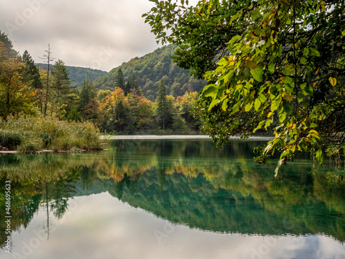 Fototapeta Naklejka Na Ścianę i Meble -  Beautiful reflection of trees and mountains in one of the lakes of the Plitvice Lakes District in Croatia. 