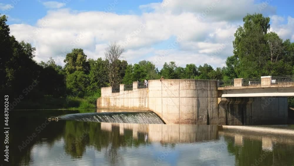 Yaropoletskaya HPP named after V. Lenin. Moscow region, the village of Yaropolets. July 4, 2021. Hydroelectric power station, dam of a river with running water on a summer day. Yaropoletskaya HPP named after V. Lenin. Moscow region, the village of Yaropolets. July 4, 2021. Hydroelectric power station, dam of a river with running water on a summer day.