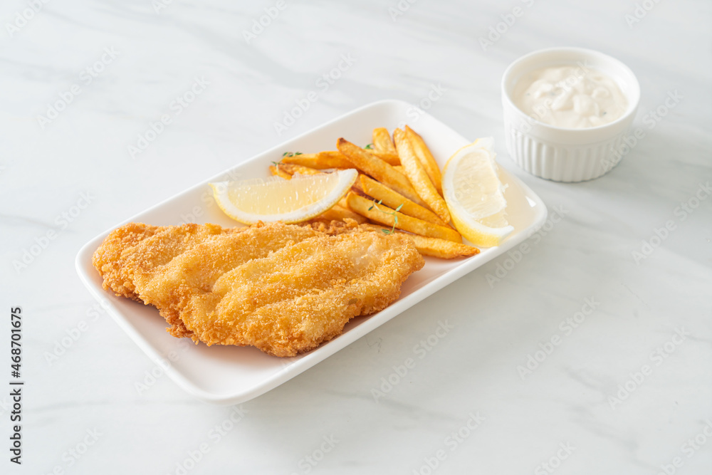 fish and chips - fried fish fillet with potatoes chips fish and chips - fried fish fillet with potatoes chips