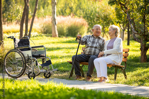 Cheerful senior couple relaxing in the park photo