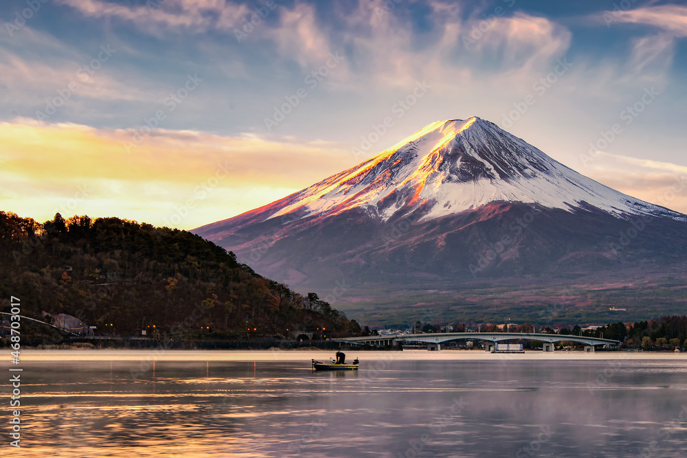 Fuji Mountain and Fisherman boat in Kawaguchiko lake at Sunrise, Yamanashi, japan Fuji Mountain and Fisherman boat in Kawaguchiko lake at Sunrise, Yamanashi, japan