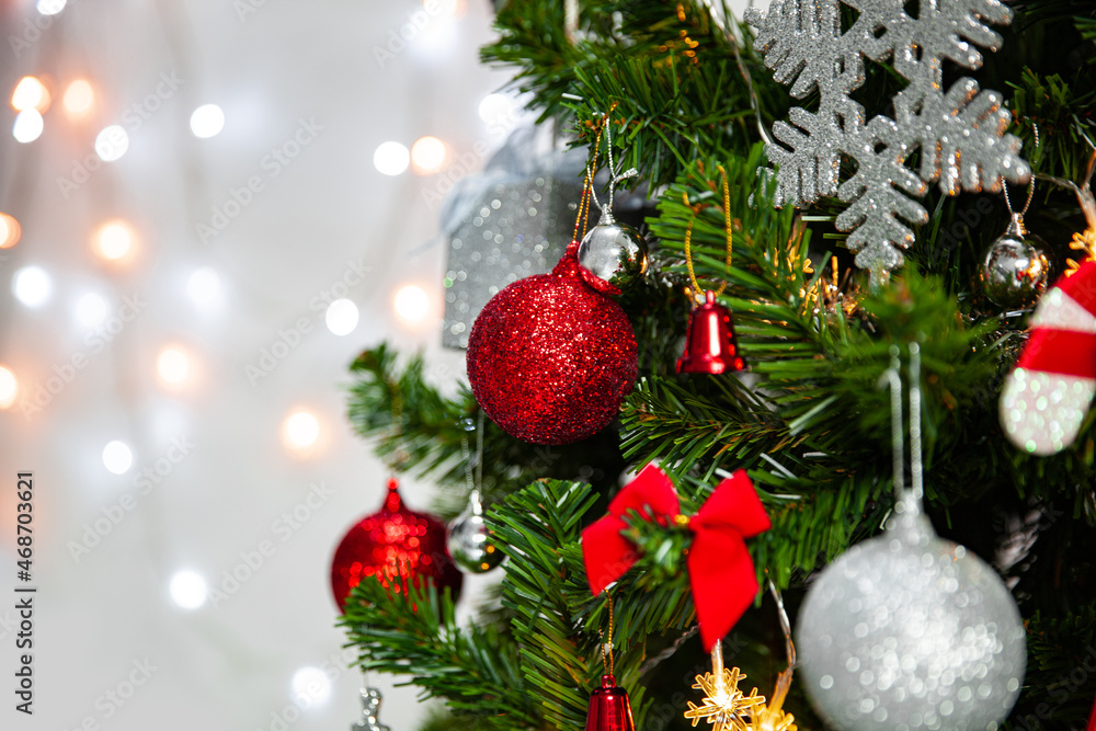 Christmas Tree with red and silver decoration on blurred light background, Holidays Concepts background with copy space Christmas Tree with red and silver decoration on blurred light background, Holidays Concepts background with copy space