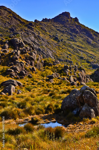 Morro do Couto peak (2.680m), the eighth tallest in Brazil, towers above the boulder-filled high sector of Itatiaia National Park, Itatiaia, Rio de Janeiro, Brazil photo