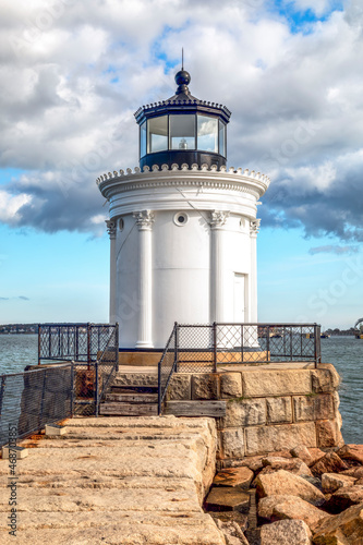 Resembling a Greek monument with Corinthian columns, Portland Breakwater Lighthouse, also called Bug Light, marks the harbor at Portland, Maine in the New England region of the USA.