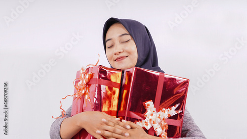 Canvas Print cute asian girl very happy with the gift isolated on white background