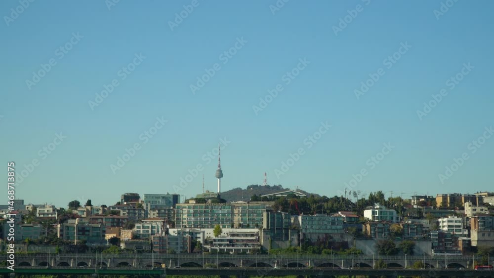 Namsan Tower seen over the Yongsan District of Seoul, South Korea city skyline - traffic and cityscape on a clear day, copy space Namsan Tower seen over the Yongsan District of Seoul, South Korea city skyline - traffic and cityscape on a clear day, copy space