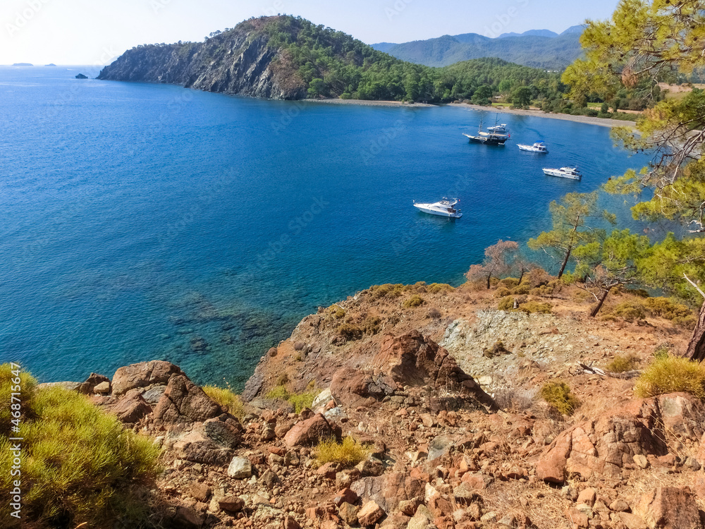 View of the stone beach at the site of the ancient Lycian city of Phaselis. Historic site View of the stone beach at the site of the ancient Lycian city of Phaselis. Historic site