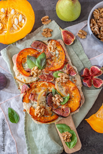 home made autumn pizza with pumpkin and figs photo