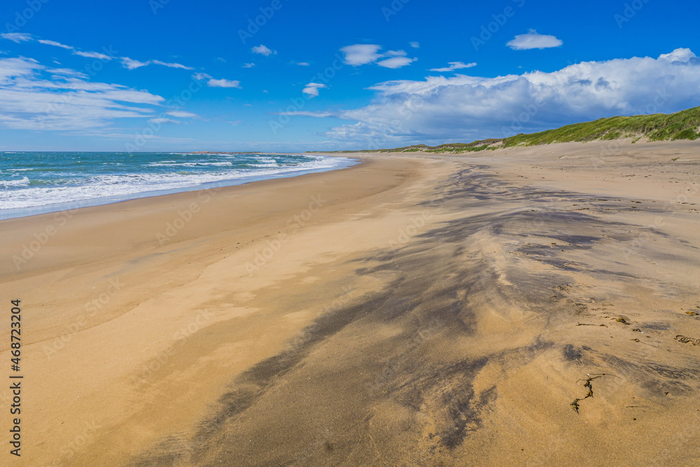 The beautiful sandy beach of Aguanish on a summer day, located in the Cote Nord region of Quebec, Canada The beautiful sandy beach of Aguanish on a summer day, located in the Cote Nord region of Quebec, Canada