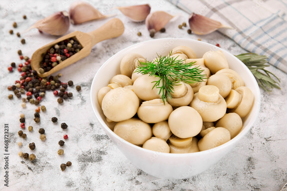 Pickled mushrooms - champignons in a bowl. Delicious mushrooms, champignon. Pickled mushrooms - champignons in a bowl. Delicious mushrooms, champignon.