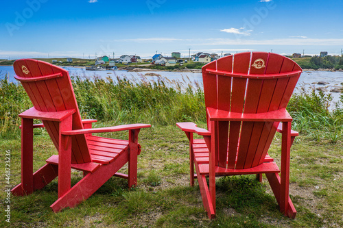 Canada Parks red adirondack chairs in Aguanish, a small town located in Cote Nord region of Quebec (Canada)