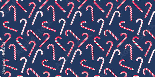 Christmas and Happy New Year seamless pattern Vector with Christmas candy cane. Trendy retro style. Vector design template. Vector illustration for fabric, wallpaper, wrapping paper, craft, texture.