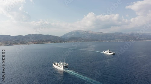 Aerial view of ferry boats and the Rio Antirio Charilaos Trikoupis bridge in Greece