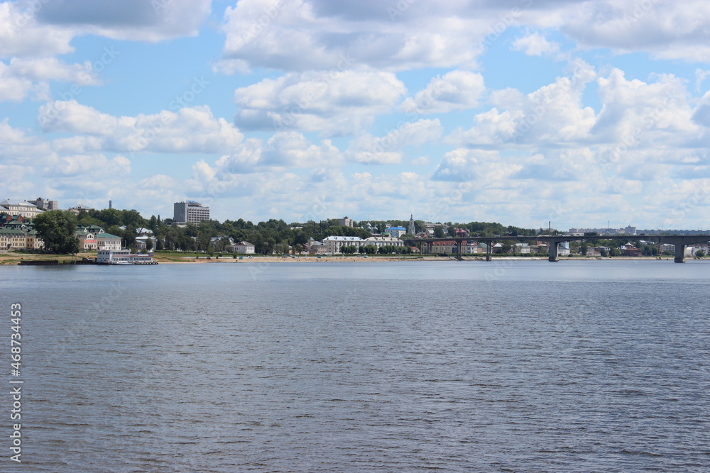 View from a motor ship sailing along the Volga River to the city of Kostroma standing on the shore