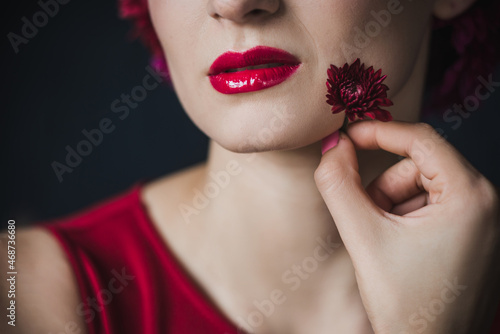 closeup of red lips makeup portrait of beautiful woman