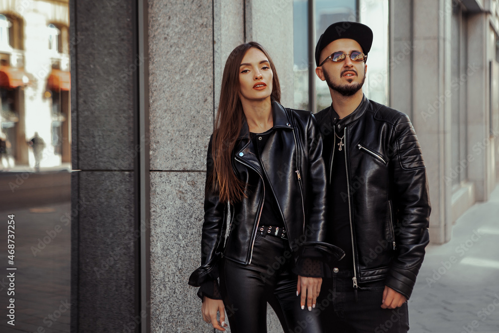 Fashionable young couple posing in the city Fashionable young couple posing in the city