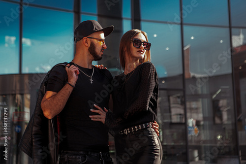 closeup portrait of Handsome young couple posing in the street daytime © ponomarencko