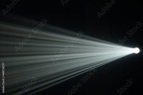 Light beam from spotlight or projector texture and black  background  and copy space - backdrop image photo