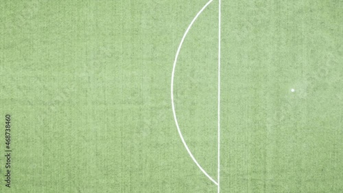 Aerial eagle eye view moving to the left of football field terrain and lines