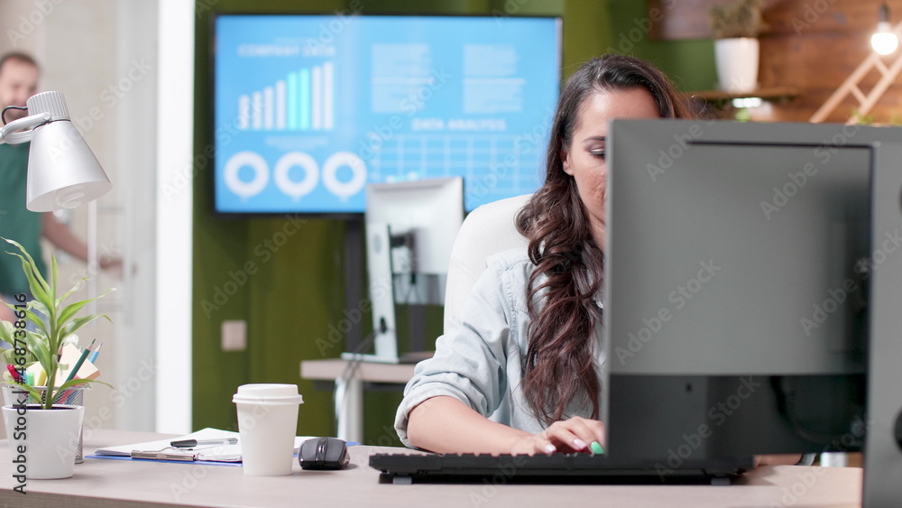 Businesswoman sitting at desk typing marketing strategy on computer keyboard working at online business presentation in startup company office. Successful entrepreneur planning management partnership Businesswoman sitting at desk typing marketing strategy on computer keyboard working at online business presentation in startup company office. Successful entrepreneur planning management partnership