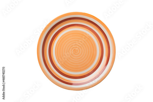 Orange ceramic round plate isolated over white background. Top view