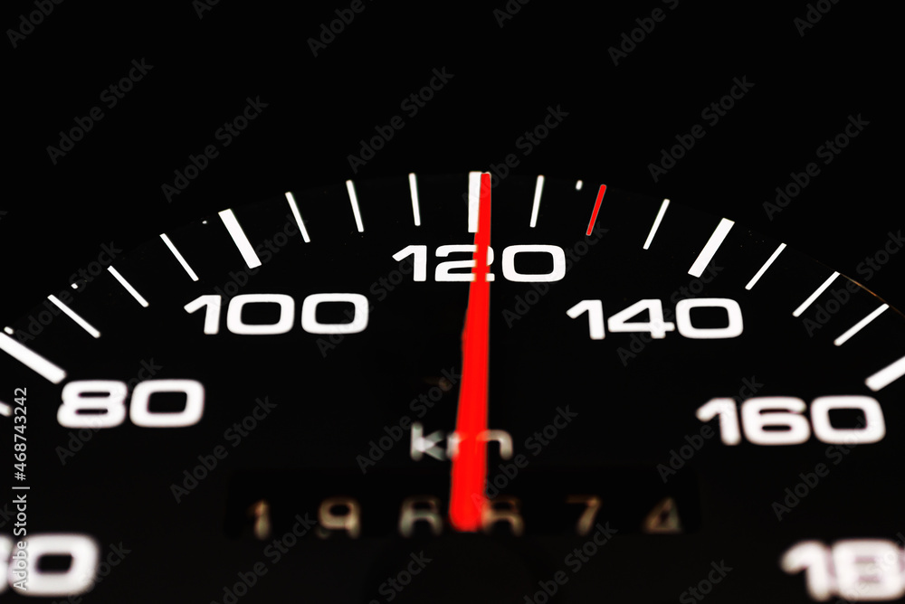 Car speedometer with the needle pointing a high speed at blackground, Speedometer with a red arrow indicating speeding, conceptual image for excessive speeding or careless driving concept.Close-up. Car speedometer with the needle pointing a high speed at blackground, Speedometer with a red arrow indicating speeding, conceptual image for excessive speeding or careless driving concept.Close-up.