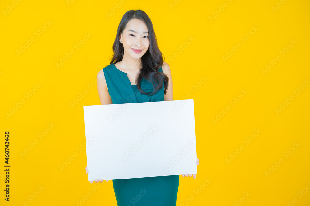 Portrait beautiful young asian woman with empty white billboard Portrait beautiful young asian woman with empty white billboard