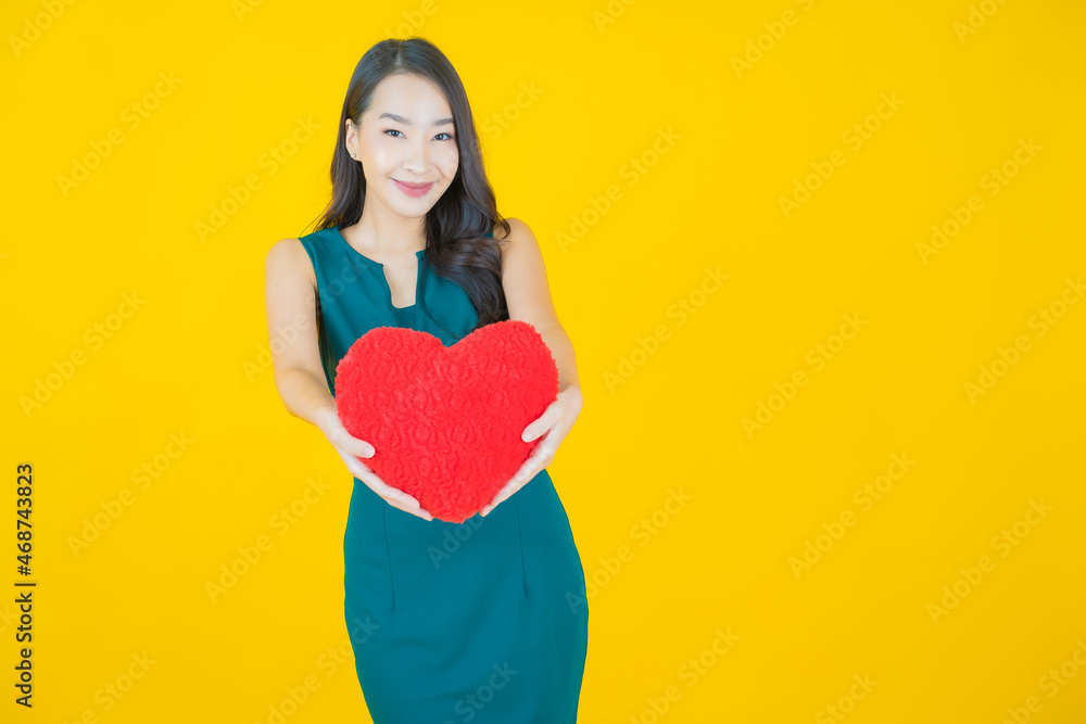 Portrait beautiful young asian woman smile with heart pillow shape Portrait beautiful young asian woman smile with heart pillow shape