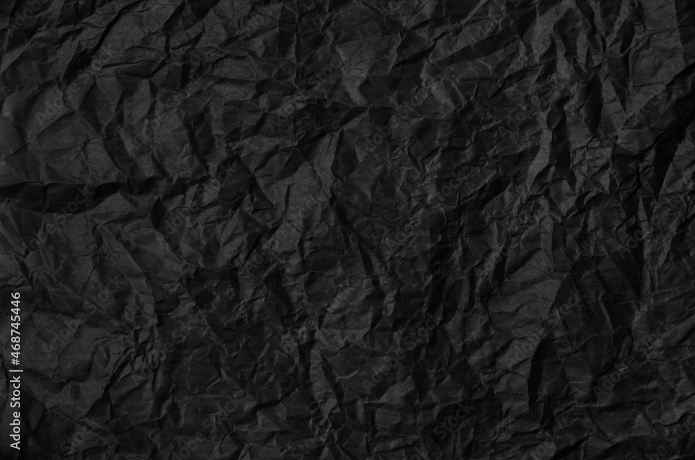 Crumpled black paper background texture Crumpled black paper background texture