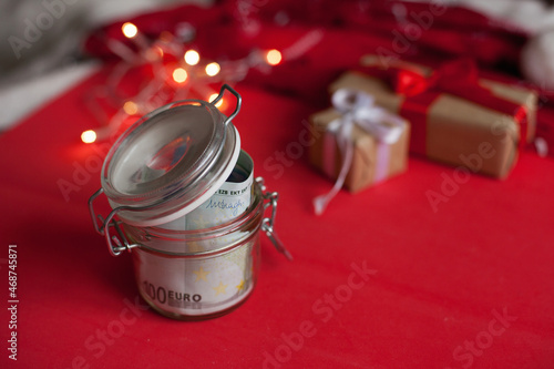 Cash euro money in moneybox for christmas gifts - christmas presents expenses