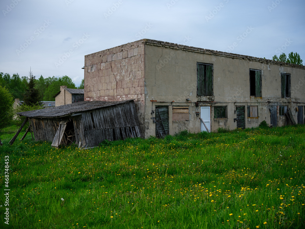 old countryside barn from wooden planks and concrete in rural area old countryside barn from wooden planks and concrete in rural area