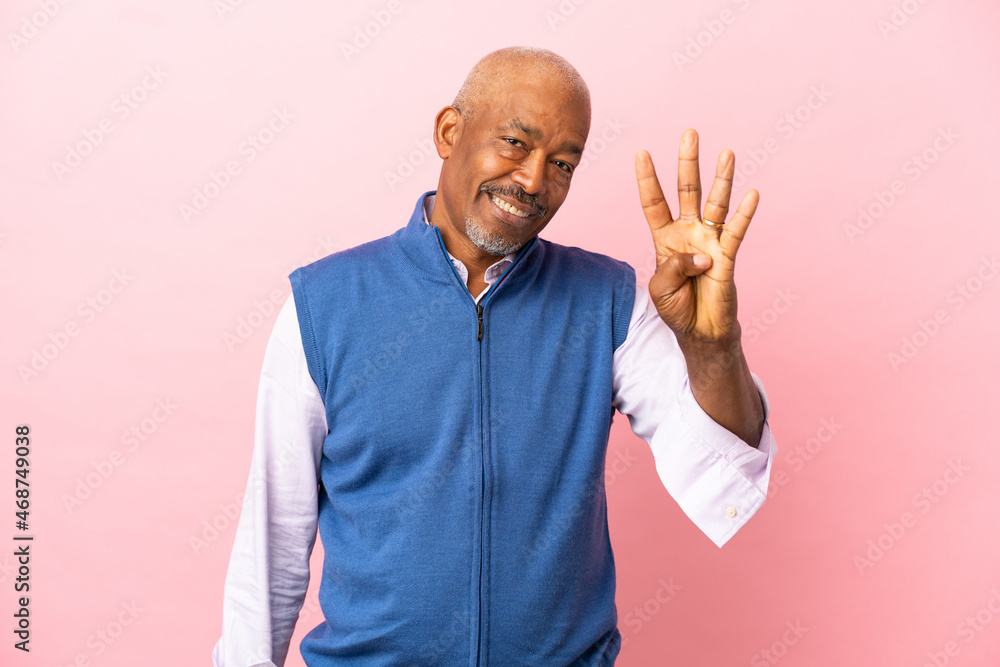 Cuban senior isolated on pink background happy and counting four with fingers Cuban senior isolated on pink background happy and counting four with fingers